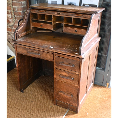 10 - An early 20th century oak tambour roll top desk, 92 cm w x 66 cm d x 112 cm h