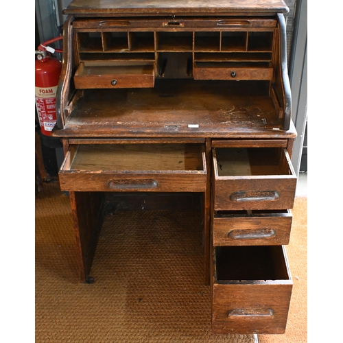 10 - An early 20th century oak tambour roll top desk, 92 cm w x 66 cm d x 112 cm h