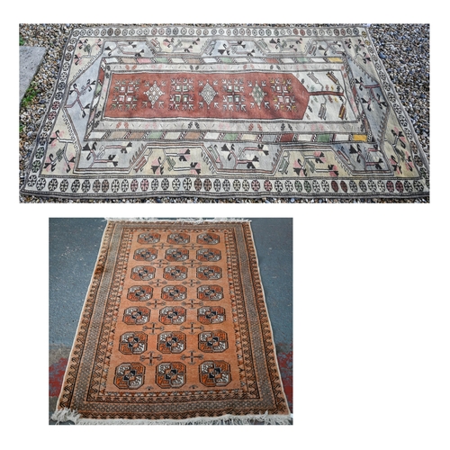 183 - An old golden ground washed Afghan rug, with three rows of stylised guls, 190 cm x 110 cm to/with an... 