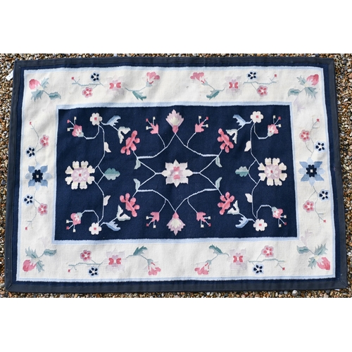 190 - # A blue ground floral rug with cream borders, 182 x 129 cm