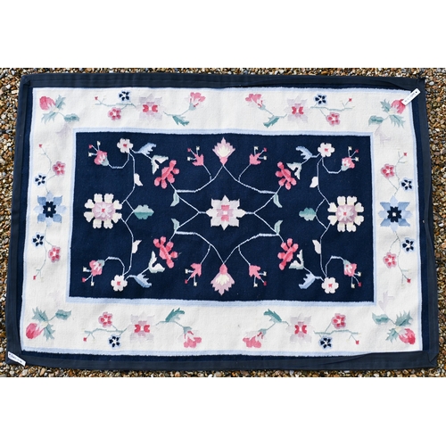 190 - # A blue ground floral rug with cream borders, 182 x 129 cm