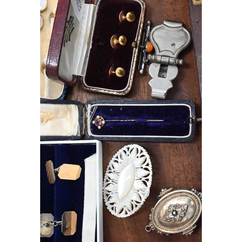 469 - A cased set of gilt metal and mother of pearl studs and buttons, a cased set of three gilt metal stu... 