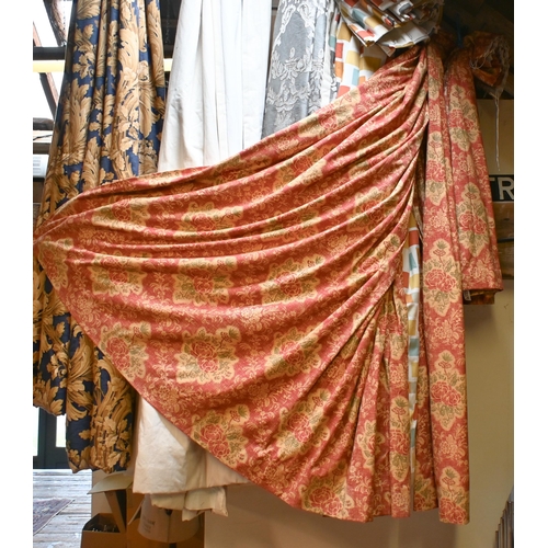 547 - A pair of printed cotton curtains, 212 x 191 cm, terracotta ground with floral design