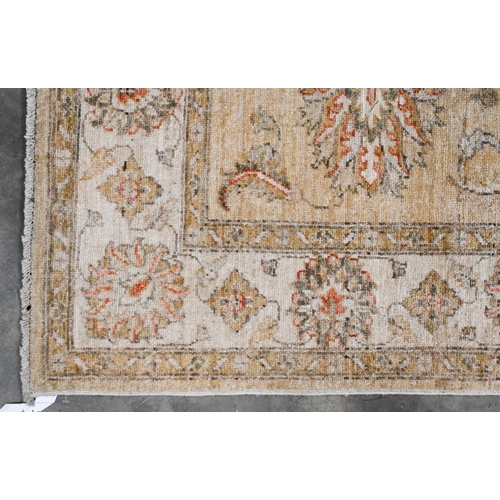 95 - An Indian Agra Ziegler design rug, camel ground with floral design, lighter palmette border, 180 x 1... 