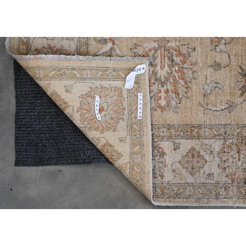 95 - An Indian Agra Ziegler design rug, camel ground with floral design, lighter palmette border, 180 x 1... 