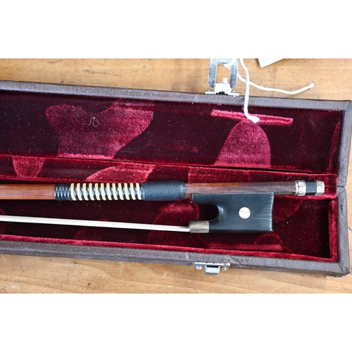 497 - A cased (restored) cello bow with mother of pearl inlaid ebony frog and white metal mounts circa 190... 