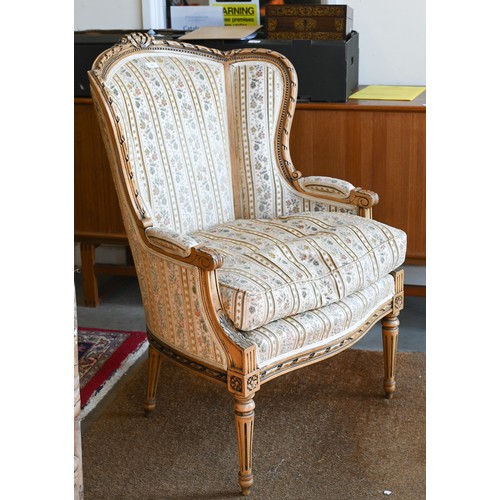 106 - A French wingback armchair, 20th century, floral brocade-style striped fabric