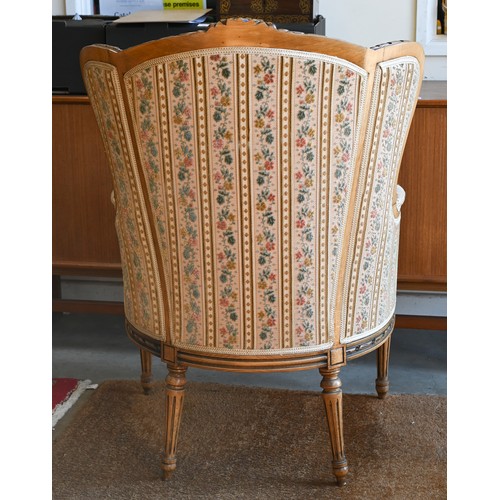 106 - A French wingback armchair, 20th century, floral brocade-style striped fabric