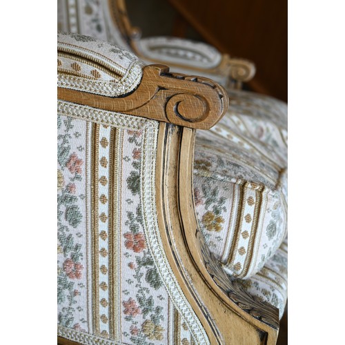 106 - A French wingback armchair, 20th century, floral brocade-style striped fabric