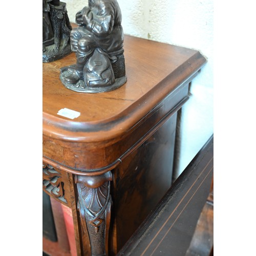 1 - A Victorian walnut breakfront bookcase with fret-cut and carved decorative mouldings, glazed central... 