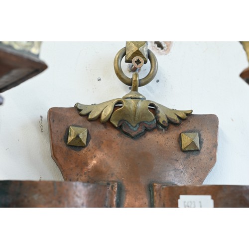 174 - A pair of Arts and Crafts copper and brass Gothic style twin branch sconces, 25 cm high