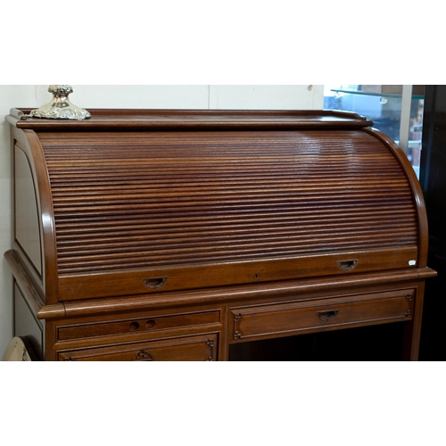 13 - A Chinese hardwood tambour roll-top desk with fitted interior over six drawers with 'shou' symbol ha... 