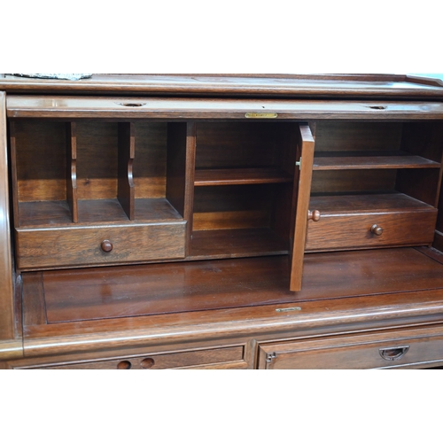 13 - A Chinese hardwood tambour roll-top desk with fitted interior over six drawers with 'shou' symbol ha... 