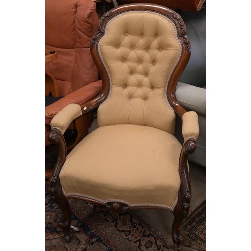 23 - A Victorian mahogany open armchair in old gold button back upholstery to/w a Victorian oak framed bu... 