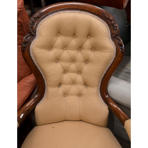 23 - A Victorian mahogany open armchair in old gold button back upholstery to/w a Victorian oak framed bu... 