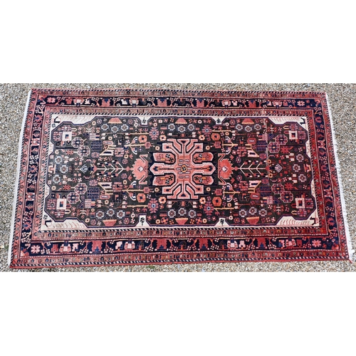 34 - An old Persian Hamadan red ground rug, stylised floral design, 300 cm x 163 cm