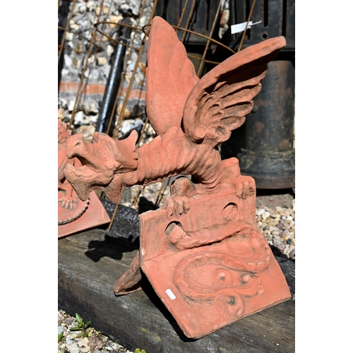 A large cast terracotta dragon ridge tile, 60 cm h