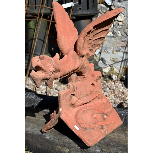 A large cast terracotta dragon ridge tile, 60 cm h