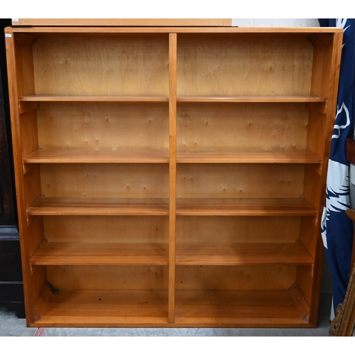 100 - A modern open bookcase with four fixed shelves, 138 cm x 30 cm x 125 cm h to/w a similar smaller exa... 