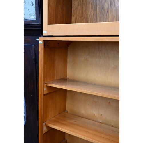 100 - A modern open bookcase with four fixed shelves, 138 cm x 30 cm x 125 cm h to/w a similar smaller exa... 