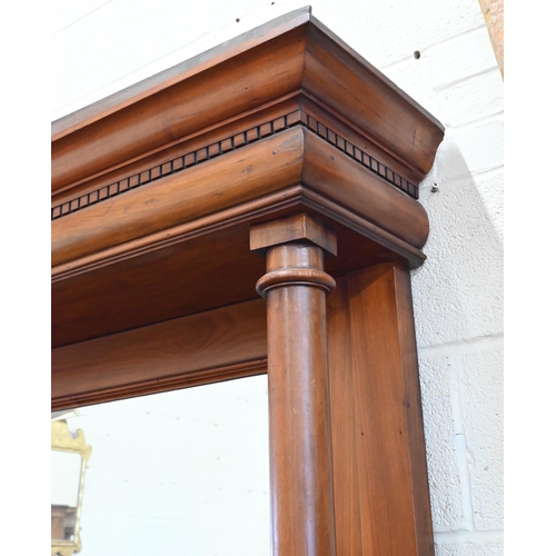 101 - A substantial Art Nouveau carved walnut mirror-backed sideboard with bevelled plate between turned p... 