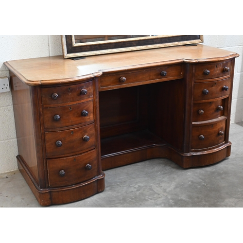 102 - A Victorian mahogany serpentine front dressing table with nine drawers to/w an oval mahogany framed ... 