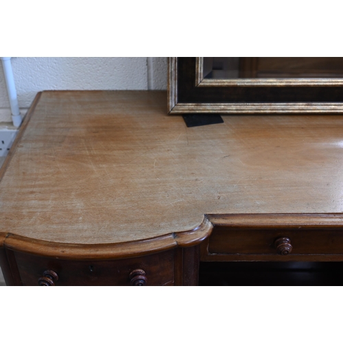 102 - A Victorian mahogany serpentine front dressing table with nine drawers to/w an oval mahogany framed ... 