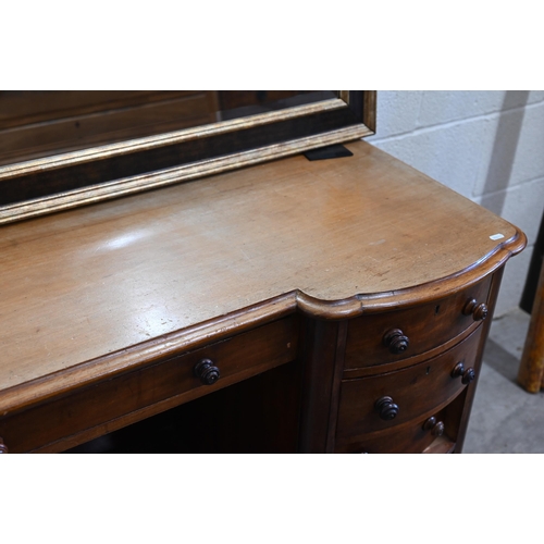 102 - A Victorian mahogany serpentine front dressing table with nine drawers to/w an oval mahogany framed ... 