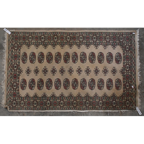 17 - An antique Persian Shiraz rug with geometric and stylised floral design, 200 cm x 126 cm to/w a Paki... 