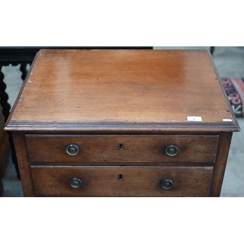 2 - A small 19th century mahogany chest of three long drawers raised on chamfered square supports, 64 cm... 