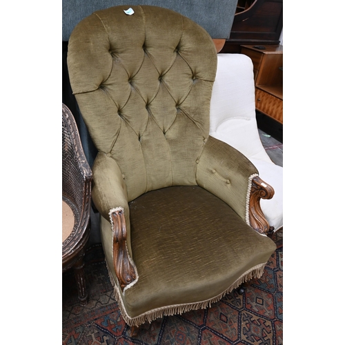 23 - A Victorian mahogany open armchair in old gold button back upholstery to/w a Victorian oak framed bu... 