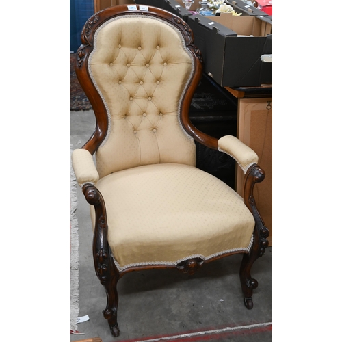 23 - A Victorian mahogany open armchair in old gold button back upholstery to/w a Victorian oak framed bu... 