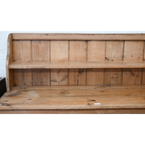 3 - A vintage pine low dresser with two drawers over panelled cupboards, 134 cm w x 52 cm d x 130 cm h