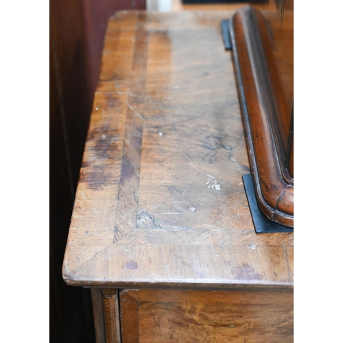 36 - A Georgian walnut feather banded chest of two short over three long graduating drawers raised on sha... 