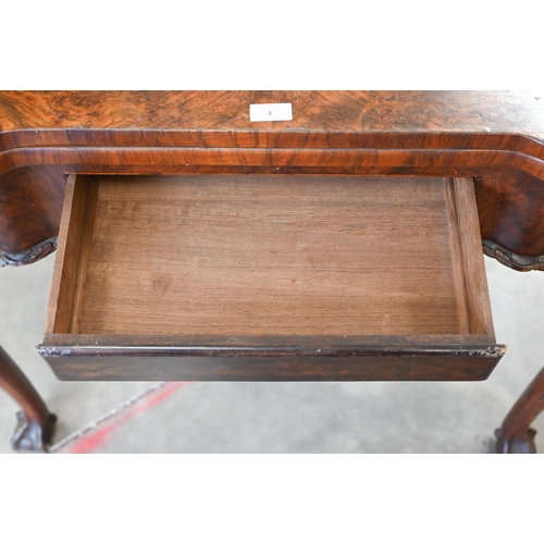 4 - A George II style figured walnut gate-leg card table, the shaped baize lined folding top over a sing... 