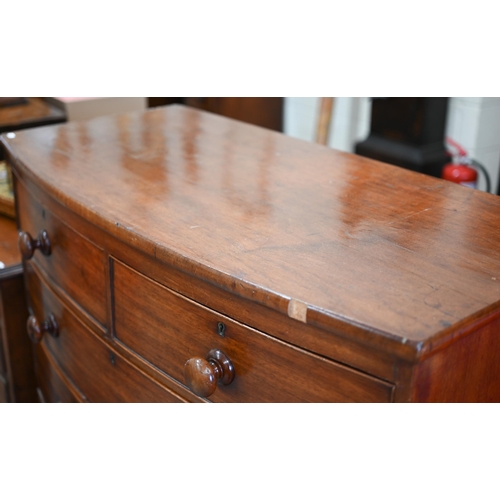 43 - A 19th century mahogany bowfront chest of two short over three long drawers raised on turned support... 