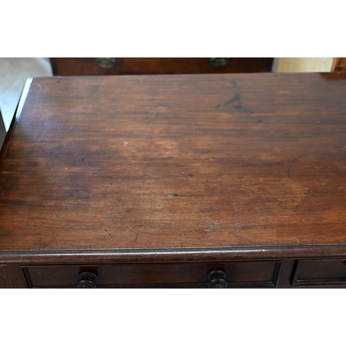 44 - A 19th century mahogany two-drawer hall table on turned supports, 106 cm x 54 cm x 72 cm h