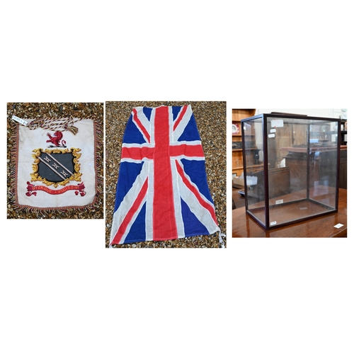 459 - A vintage stitched linen Union flag, 177 x 80 cm to/w a needlework armorial banner and a glazed disp... 