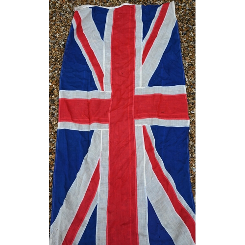 459 - A vintage stitched linen Union flag, 177 x 80 cm to/w a needlework armorial banner and a glazed disp... 