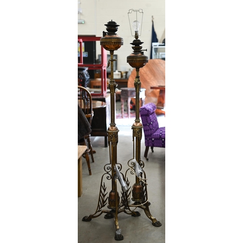 468 - A rare pair of Victorian gilt-brass telescopic floor standing oil-lamps, with copper reservoirs, lat... 