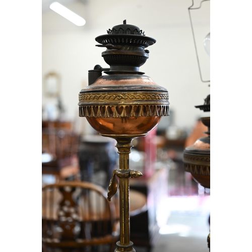 468 - A rare pair of Victorian gilt-brass telescopic floor standing oil-lamps, with copper reservoirs, lat... 