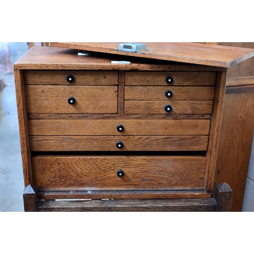 469 - An oak engineer's tool-chest fitted with eight drawers, 43 cm wide to/w an oak stick-stand (2)