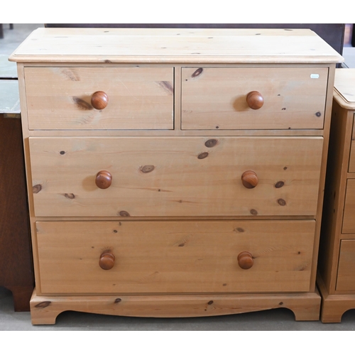 47 - A pine chest of two short over two long deep drawers with turned handles, 96 cm w x 44 cm d x 88 cm ... 