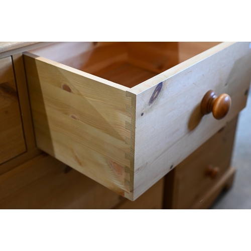 47 - A pine chest of two short over two long deep drawers with turned handles, 96 cm w x 44 cm d x 88 cm ... 