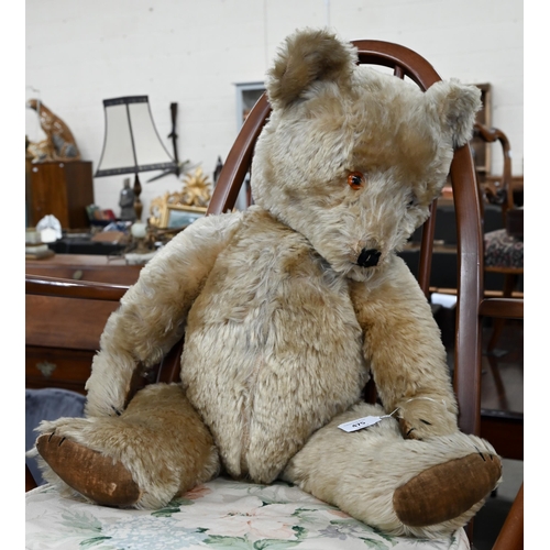 475 - A large vintage mohair teddy bear with plastic eyes, stitched nose and velvet pads, swivelling head ... 