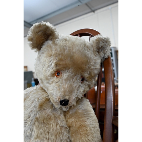 475 - A large vintage mohair teddy bear with plastic eyes, stitched nose and velvet pads, swivelling head ... 