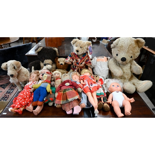 476 - A mixed collection of vintage dolls and teddies to/w a metal cot and pram, etc