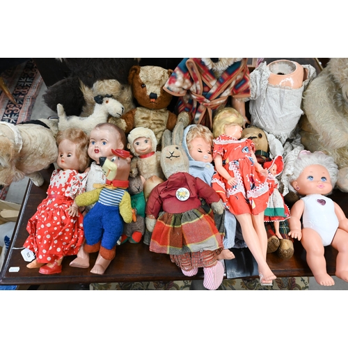 476 - A mixed collection of vintage dolls and teddies to/w a metal cot and pram, etc