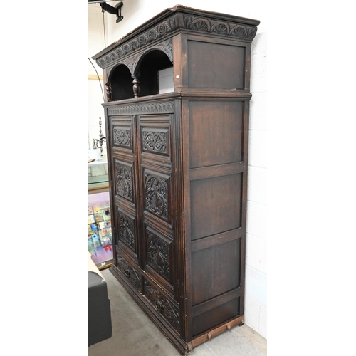 48 - A 17th century oak court cupboard, the recessed canted sided upper cupboard with arcaded moulded pan... 