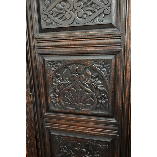 48 - A 17th century oak court cupboard, the recessed canted sided upper cupboard with arcaded moulded pan... 